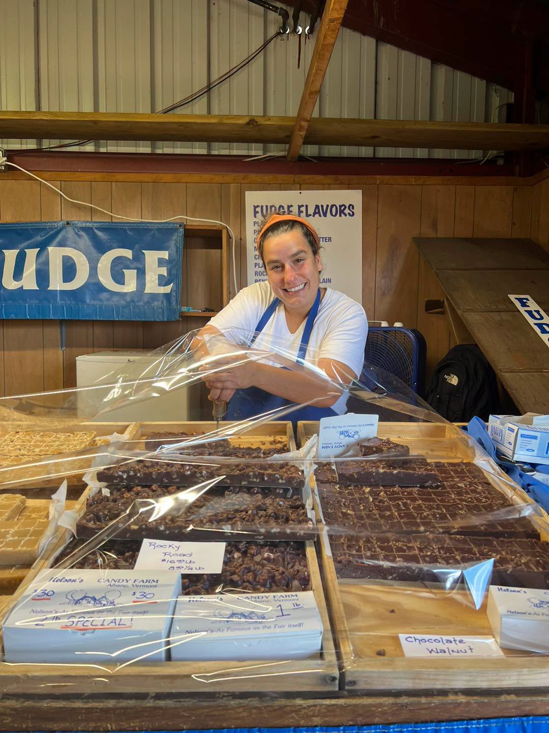 Vendor and fudge display at a fair
